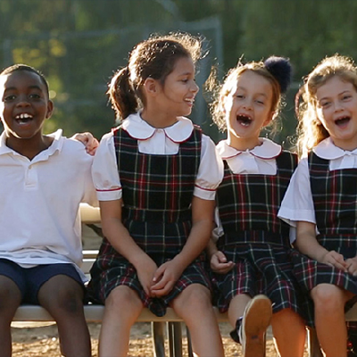 Photo courtesy of client St. John’s Episcopal School; group of school kids dressed in uniform